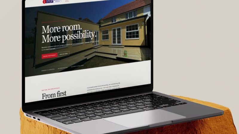 The 1 Stop Building website displayed on a laptop