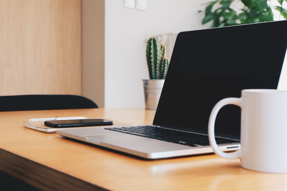 Laptop and phone on an office desk